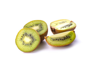 Kiwi fruit with pieces isolated on a white background, close -up.