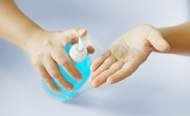 Female hand using alcohol gel disinfecting hands. prevent against infection of Covid-19 outbreak