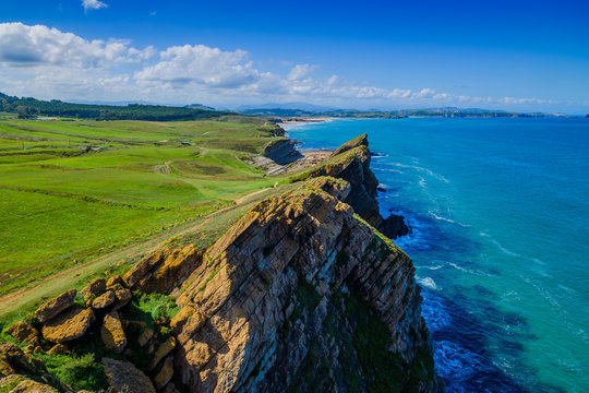 Incredible cliffs on the coast near the village of Liencres. Cantabria. Northern coast of Spain
