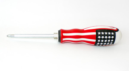 A screwdriver in the design of the us flag . Isolated screwdriver on a white background. Original screwdriver with the image of the American flag . Template. Curly screwdriver. Household tools.