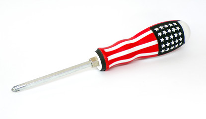 Screwdriver. A screwdriver with an image in the style of the American flag . US flag on a screwdriver close -up on a white background. The metal screwdriver is isolated on a white background. Template