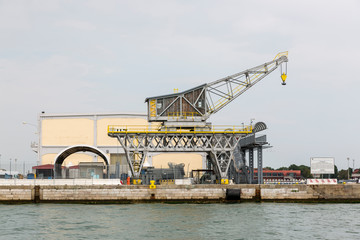 Fototapeta premium Crane in the commercial seaport of Venice