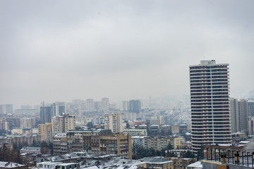 Fototapeta na wymiar Snowing in downtown of Tbilisi