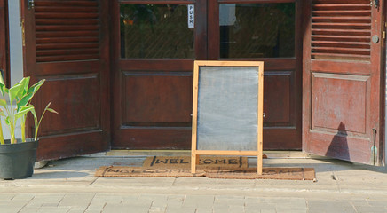 Chalkboard menu sign mockup at front of door 