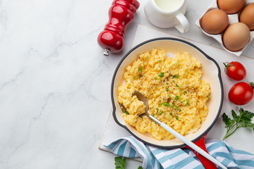 scrambled eggs for breakfast on frying pan
