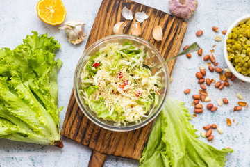 Detox fresh seasonal vegetables salad. Cabbage. Glass bowl. 
