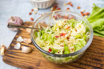 Detox fresh seasonal vegetables salad. Cabbage. Glass bowl. 