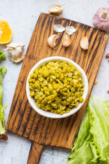 Green peas beans cooked in bowl. Table, kitchen