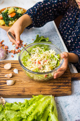 Detox fresh seasonal vegetables salad. Cabbage. Glass bowl. 
