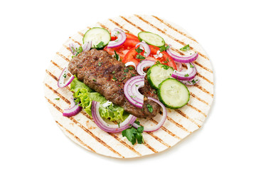 Grilled meat kebabs (cutlets) served with vegetables and tortilla, flatbread. isolated on white background