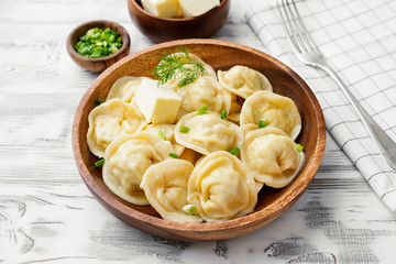 Homemade meat dumplings - russian pelmeni. Dumplings, filled with meat, ravioli.