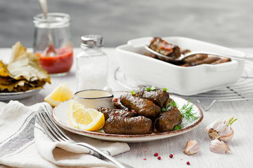 Dolma - stuffed grape leaves with rice and meat. Traditional Turkish and Greek dish