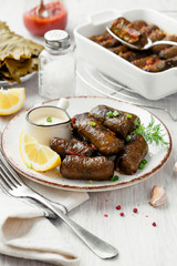 Dolma - stuffed grape leaves with rice and meat. Traditional Turkish and Greek dish
