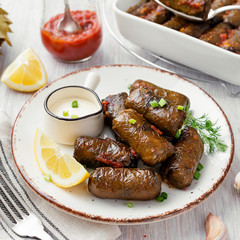 Dolma - stuffed grape leaves with rice and meat. Traditional Turkish and Greek dish