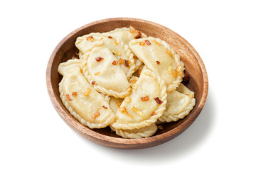 Dumplings, filled with mashed potato served with fried onion and sour cream. isolated on white...