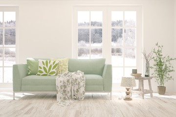 White living room with sofa and winter landscape in window. Scandinavian interior design. 3D illustration