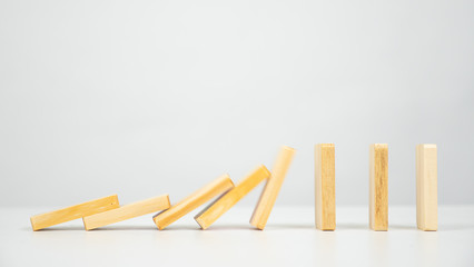 Domino falling on white background