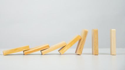 Domino falling on white background