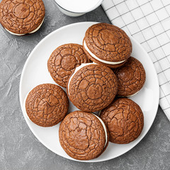 Chocolate  brownie - sandwich cookies with cream cheese filling . top view