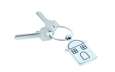 key chain with house symbol and keys on white background,Real estate concept