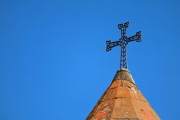 Cross of the Armenian Apostolic Church on Vivid Sunny Blue Sky