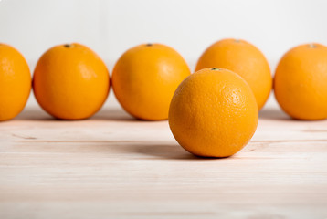 Fresh Oranges on Wood Table