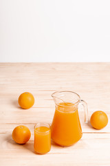 glass and jar of fresh orange juice