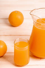 glass and jar of fresh orange juice