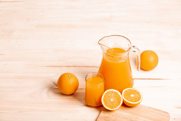glass and jar of fresh orange juice
