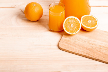 glass and jar of fresh orange juice