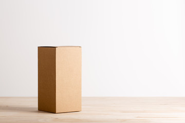 cardboard box  on wooden table