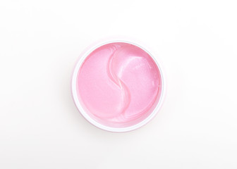 Pink Under eye patches with collagen on white background. Flat lay.