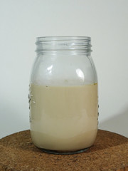 A Glass of Ice Coffee Latte on Cork Coaster