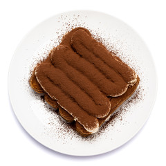 Classic tiramisu dessert on ceramic plate isolated on white background with clipping path