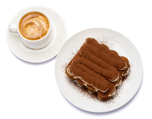 Classic tiramisu dessert on ceramic plate and cup of coffee isolated on white background with clipping path