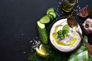 Ingredients for making tradtional greek sauce tzatziki. Top view with copy space.