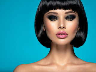Glamour fashion model with black gloss make-up. Beautiful fashion woman with a bob hairstyle....