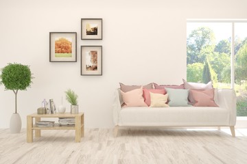 White living room with sofa and summer landscape in window. Scandinavian interior design. 3D illustration