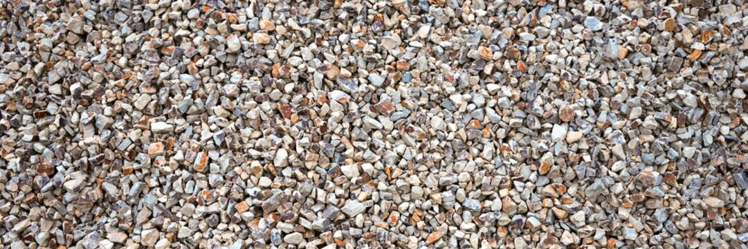 Panoramic image of colorful gravel stones. Gravel stones for the construction industry