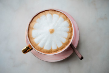 cup of cappuccino with cream