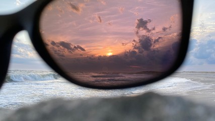 Sunset with polarized sun glasses with a pink tint