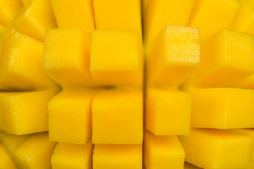 Diced mango chunks. Tropical fruits. Healthy diet food. Flat lay  Close up