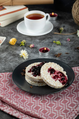 Rice jam crackers with a cup of tea on the red towel