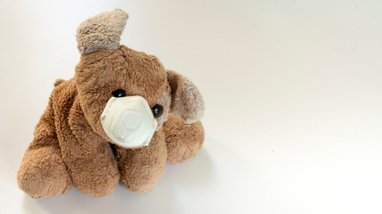 safety toy, a teddy bear with a ffp2 mask, safe children's toys