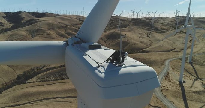 Aerial footage from a renewable energy wind turbine farm in California.