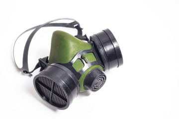 Dusty respirator with a carbon filter on a white background. The concept of respiratory protection...