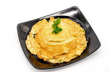 Traditional Thai Omelette with chili sauce on white background