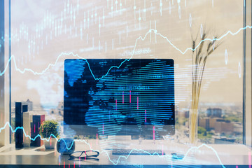 Forex market chart hologram and personal computer background. Double exposure. Concept of investment.