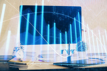 Stock market graph and table with computer background. Double exposure. Concept of financial analysis.