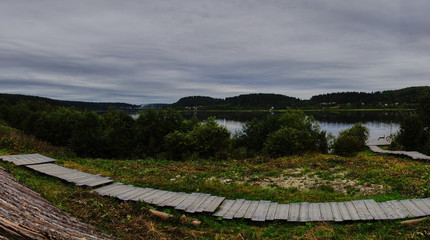 Fototapeta na wymiar Panorama of the water landscape of Karelian nature.Panoramic view of the water surface: coniferous forest, smooth surface of the lake, open horizon. Russia, Karelia, Sortavala